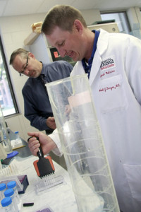 An interdisciplinary team of researchers at the University of Nebraska Medical Center in Omaha—Dan Anderson (left), Michael Duryee (right) and Geoff Thiele (not pictured)—believe they found a way to determine who will develop potentially deadly heart disease with a simple blood test.