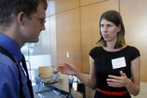 UNMC researcher Anna Brynskikh Boyum (right) chats with business partner Tom Frederick — an engineering doctorate candidate at UNL — during the 2013 UNMC Startup Company Demonstration Day reception in the Durham Research Center.