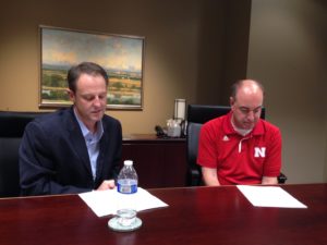 UNeMed President Michael Dixon (left) looks over his notes during his halftime interview with Greg Sharpe (right), which was broadcast Saturday night during Nebraska's 38-17 win over Northwestern. 