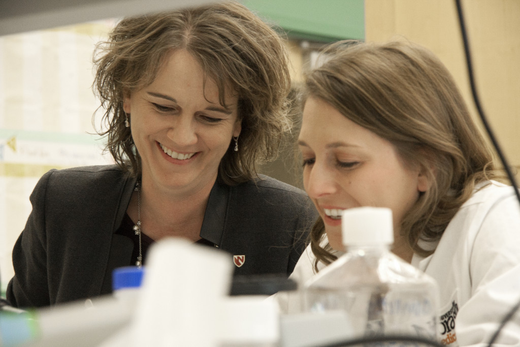 UNMC Professor of Pathology Tammy Kielian, Ph.D., (left)—seen here with doctoral student Megan Bosch—was named UNeMed's 2015 Innovator of the Year for her work against Juvenile Batten Disease and biofilm infections.