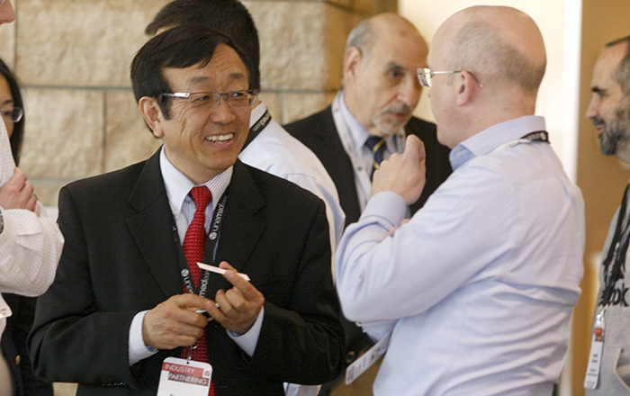 UNMC researcher Rongshi Li, Ph.D., meets with Niall O'Donnell, of the venture capital firm RiverVest, during UNeMed's 2016 Industry Partnering Summit held at UNMC's Michael F. Sorrell Center on May 10.