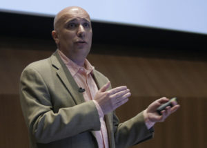 Calidum Chairman Sam Al-Murrani, Ph.D., addresses an audience during UNeMed's Demo Day event in October 2016.