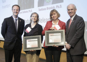 From left are UNeMed President and CEO Michael Dixon, Ph.D., Joyce Solheim, Ph.D., Tantiana Bronich, Ph.D., and UNMC Chancellor Jeffrey Gold, M.D.