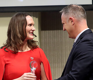 UNeMed President and CEO Michael Dixon, PhD, (right) presents UNMC researcher Rebekah Gundry,PhD, with the 2023 Emerging Inventor award during the Innovation Awards ceremony on Thursday, Nov. 2, 2023