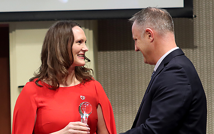 UNeMed President and CEO Michael Dixon, PhD, (right) presents UNMC researcher Rebekah Gundry,PhD, with the 2023 Emerging Inventor award during the Innovation Awards ceremony on Thursday, Nov. 2, 2023