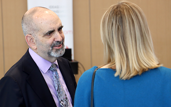 At the March 26, 2026, Morning Edition event at Catalyst Omaha, Howard Gendelman, MD—Chair of UNMC’s Department of Pharmacology and Experimental Neuroscience and Chief Science Officer at his startup, NeuralRegen—chats with a guest following his short presentation about the innovative therapies he and his company are developing for treating neurodegenerative diseases.